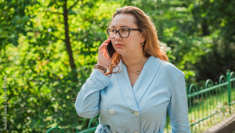 Portrait of American plus size businesswoman in light blue suit, citizen lifestyle, concept of women's life Portrait of American plus size businesswoman in light blue suit, citizen lifestyle, concept of women's life