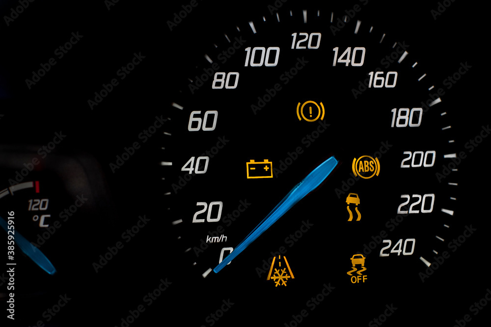 dashboard at the vehicle speed. Numbers, arrow and symbols glow on a black background. dashboard at the vehicle speed. Numbers, arrow and symbols glow on a black background.