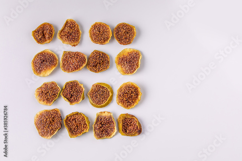 slices of dried figs on a white background. dried fruits. eco. top view.