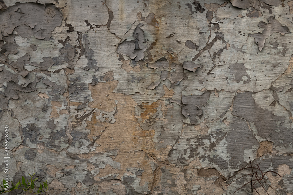 Old gray color wall painted with peeled aged paint texture Old gray color wall painted with peeled aged paint texture