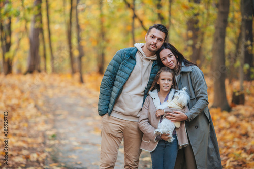 Portrait of happy family of three in autumn day © travnikovstudio