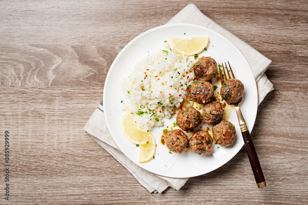 Homemade meatballs with fried rice , portion for lunch or dinner. Top view. Homemade meatballs with fried rice , portion for lunch or dinner. Top view.