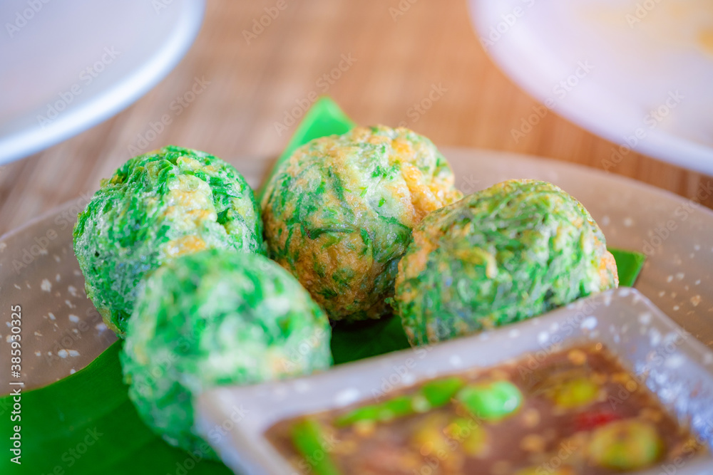 Fried Egg with Climbing Wattle and Spicy Shrimp Paste (Nam Prik Ka Pi). Asian food style. - obrazy, fototapety, plakaty 