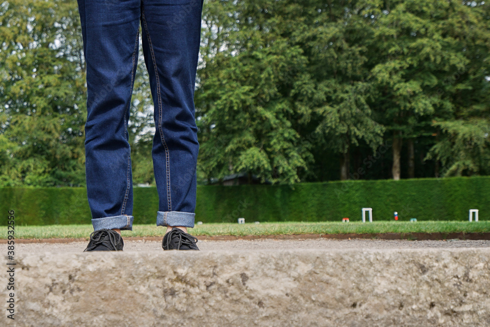 Legs of a female in blue jeans Legs of a female in blue jeans