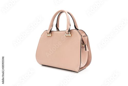 A woman's pale pink handbag on a white background.