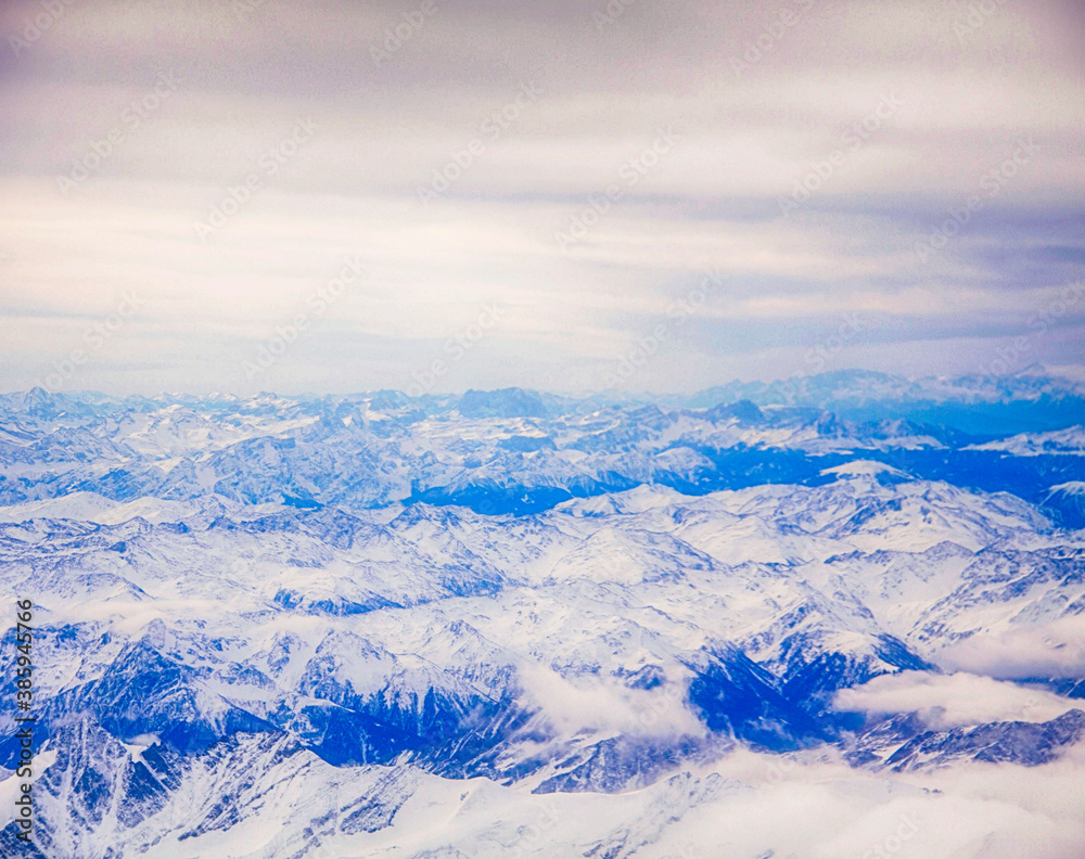 Fototapeta premium Aerial view of the Italian Alps at the end of summer with snow white peaks