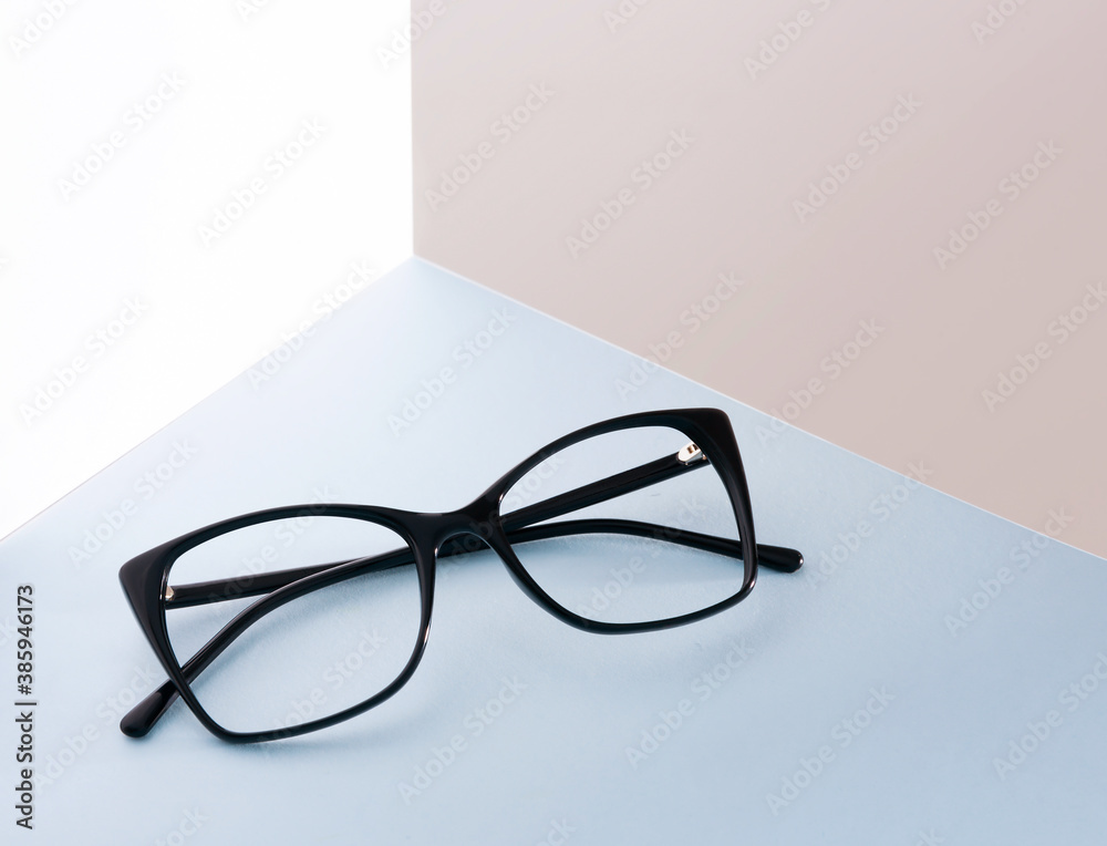 Black glasses frame in abstract composition