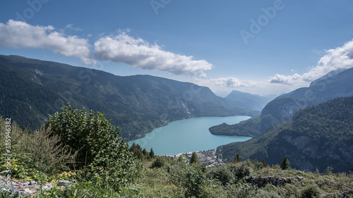 Molveno Lake, located in Trentino, by Molveno village, surrounded by Brenta group in the west & Gazza & Pagenella mountains in the south & east, as seen from Pradel high plain, Dolomites, Italy photo