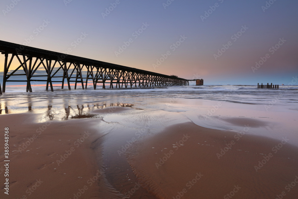 View of a Disused Pier on a calm day with clear blue sky. Hartlepool, County Durham, England, UK. View of a Disused Pier on a calm day with clear blue sky. Hartlepool, County Durham, England, UK.