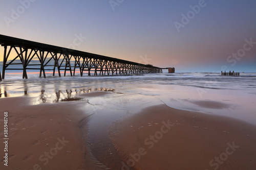 View of a Disused Pier on a calm day with clear blue sky. Hartlepool, County Durham, England, UK. photo