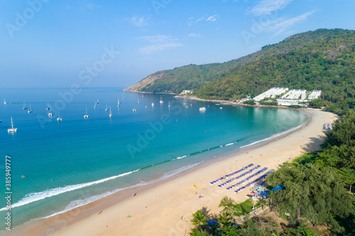 Top view aerial view photo from flying drone of tropical beach beautiful sea scenery landscape with turquoise water surface in the phuket island. © panya99