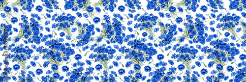 Floral seamless background from flowers of the field cornflower. White isolated background. Close-up. Concept for printing and design on fabric.