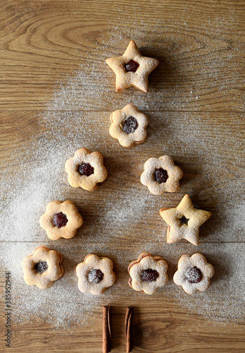 Composition with tasty Christmas cookies on wooden background.