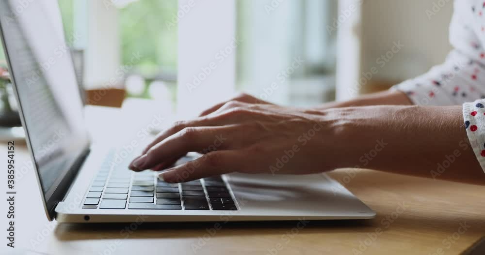 Close up female hands texting working on laptop device. Businesswoman sit at desk typing to client provide help remotely using modern wireless technology, freelancer do telework, work or study concept Close up female hands texting working on laptop device. Businesswoman sit at desk typing to client provide help remotely using modern wireless technology, freelancer do telework, work or study concept