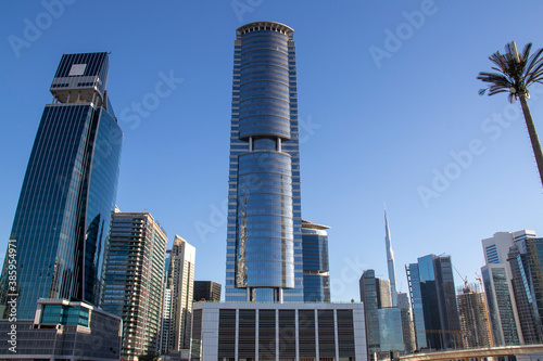 Skyscrapers of Business bay district of Dubai, UAE. Burj Khalifa, the tallest building in the world can be seen in the picture. © Four_Lakes