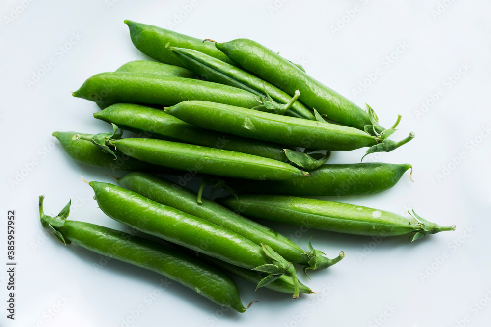 Pea pods on an isolated white background. Pea pods on an isolated white background.
