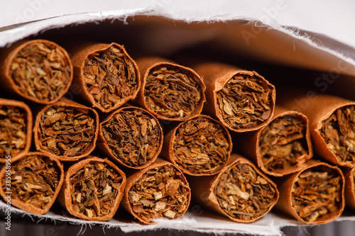 brown cigarettes in a pack close-up. horizontal frame photo