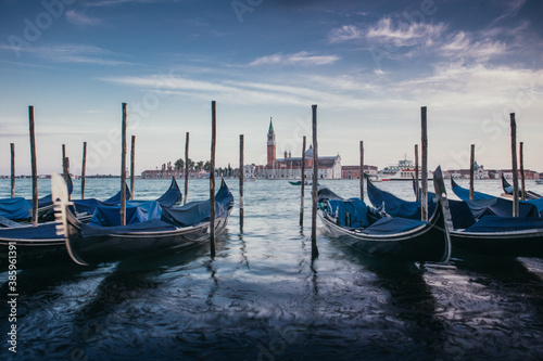 Gondolas at Dusk with saint giorgio maggiore in the background © Mustard Assets