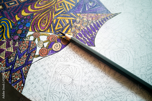 Step-by-step instructions for DIY round wall clock in zentangle technique: step 4- close up of draft coloring process,purple pencil.Part-finished drawing of curls,geometric shapes,triangles,bubbles