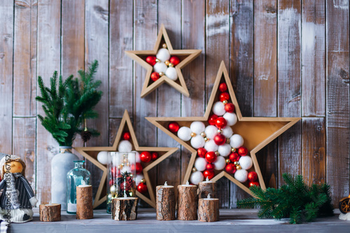Christmas decoration with candles on dark wooden background
