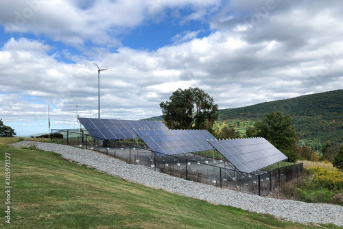 Solar panels on rolling hills in rural area in Upstate New York 