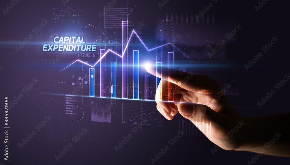 Hand touching CAPITAL EXPENDITURE button, business concept Hand touching CAPITAL EXPENDITURE button, business concept