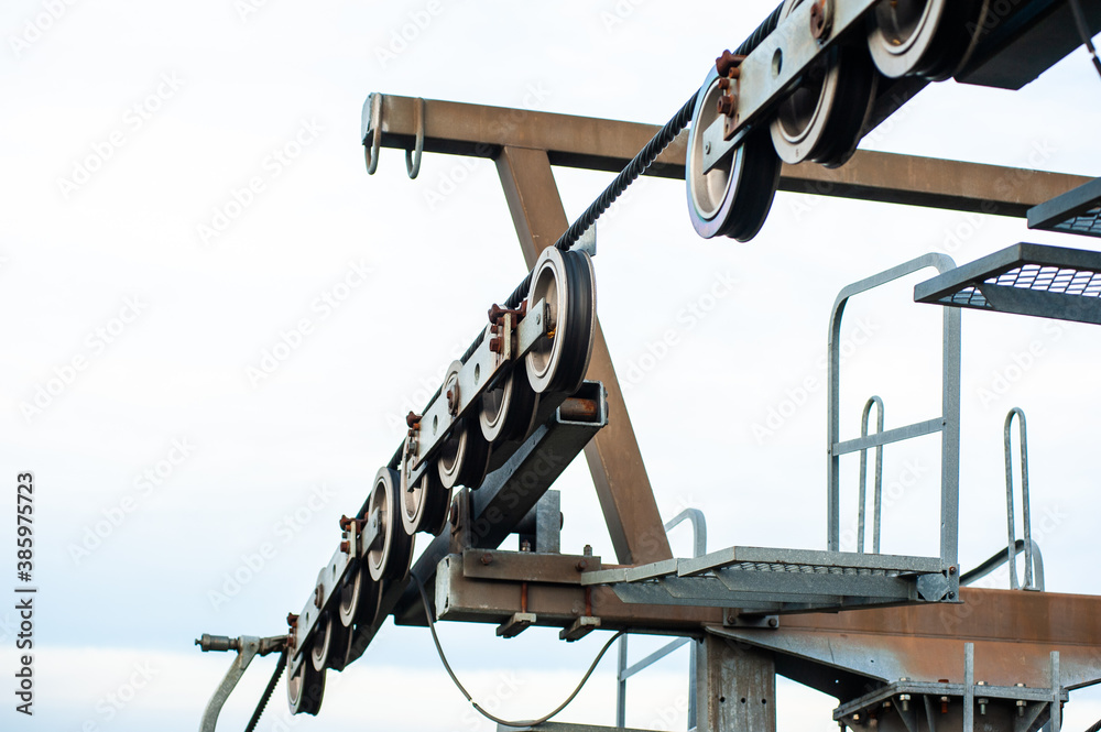 Metal structures of chair lifts in the mountains Metal structures of chair lifts in the mountains