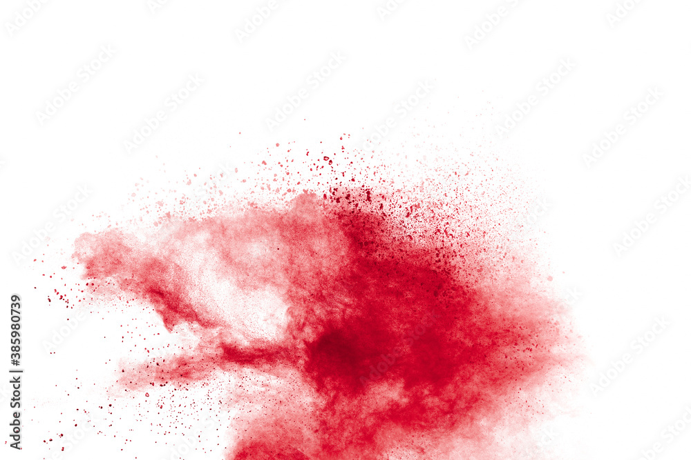 Red powder explosion on white background. Freeze motion of red dust particles splash.