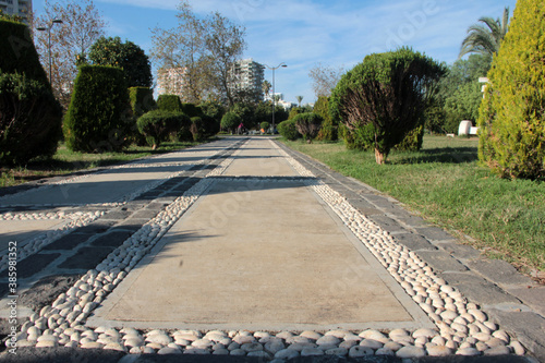 Fototapeta Naklejka Na Ścianę i Meble -  
decorative stone pavement road in the park