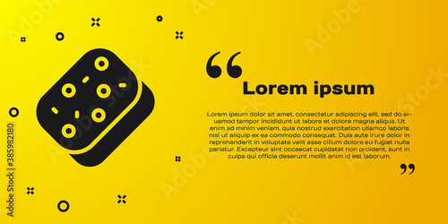 Black Sponge with bubbles icon isolated on yellow background. Wisp of bast for washing dishes. Cleaning service logo. Vector.