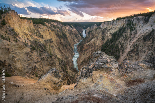 lower falls of the yellowstone national park from artist point at sunset, wyoming, usa photo