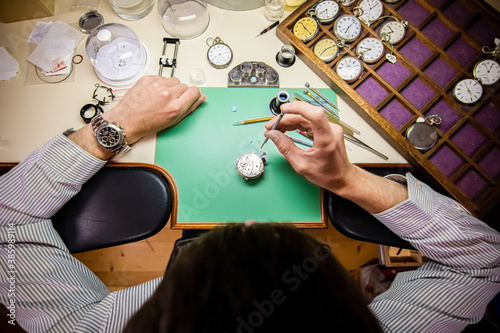 Watchmaker. Watch repair craftsman repairing watch. swiss watch repair