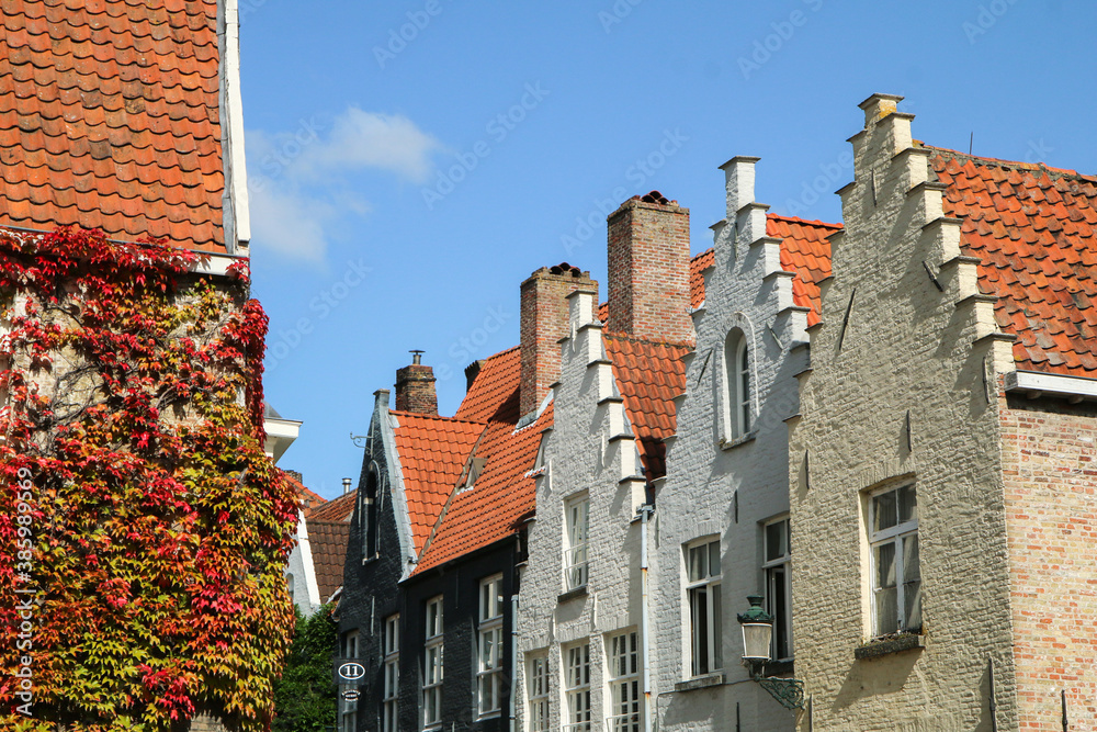 The picture from the city center of the historic and tourist attractive city of Bruges in Belguim. The traditional houses with terraced gables. 