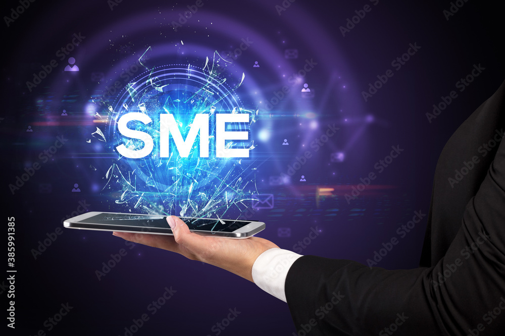 Close-up of a touchscreen with SME abbreviation, modern technology concept Close-up of a touchscreen with SME abbreviation, modern technology concept