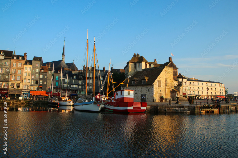 The nice and famous city of Honfleur in Normandy in France during the nice morning . The calm city with old houses. 