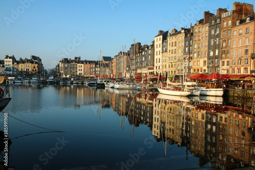 The nice and famous city of Honfleur in Normandy in France during the nice morning . The calm city with old houses. 
