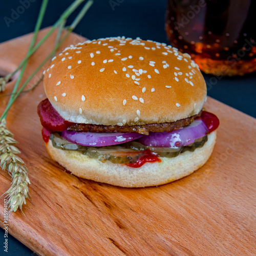 Simple hamburger on the wooden deck