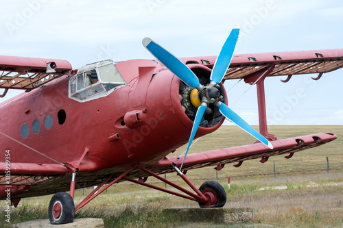 Old single-engine piston aircraft, side view.