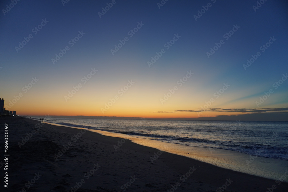 The glow of sunrise by the sea The glow of sunrise by the sea
