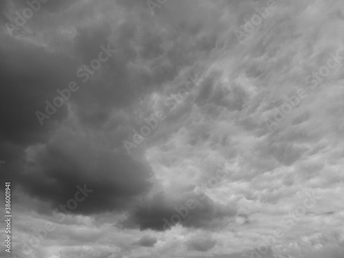 Dramatic dark cloudy sky over the South downs in England in black and white