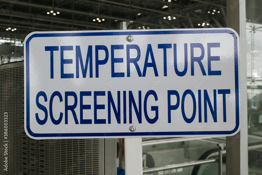 Temperature screening point sign in public transportation (airport, bus station, subway, train station), to reduce risk of further transmission, covid screening point concept