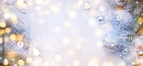 Merry Christmas and Happy New Year  Holidays greeting card with blurred bokeh background