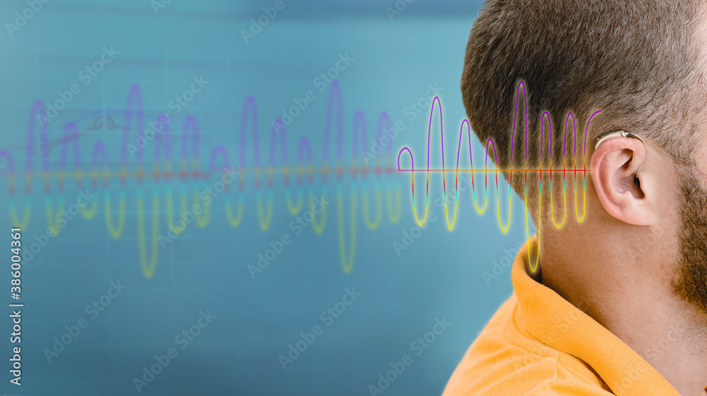 Hearing test, sound waves showing modern deafness diagnostic over male