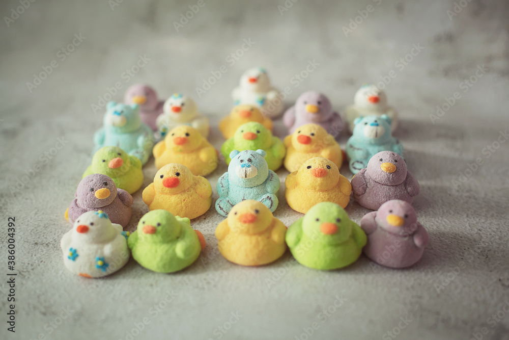 
marshmallows in the form of ducks of different colors