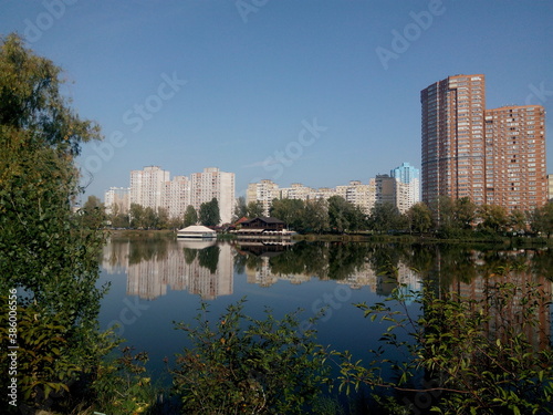 urban skyline reflected in the water