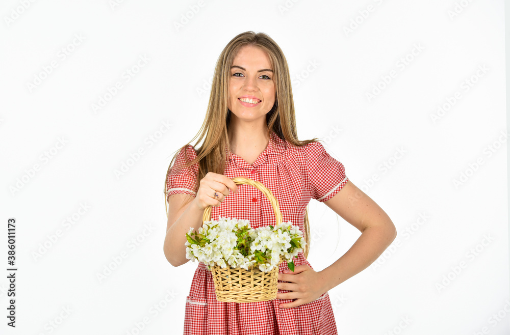 Spring in pot. natural holiday gift. happy woman carry flowers in basket. spring blossom arrangement. beautiful summer bloom. female florist designer. womens and mothers day. girl at flower shop Spring in pot. natural holiday gift. happy woman carry flowers in basket. spring blossom arrangement. beautiful summer bloom. female florist designer. womens and mothers day. girl at flower shop