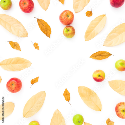 Fototapeta Naklejka Na Ścianę i Meble -  Autumn frame composition. Dried leaves and apple fruits on white background. Flat lay, top view