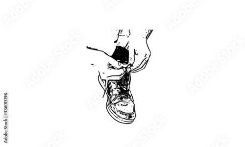 silhouette of an hand lacing shoe