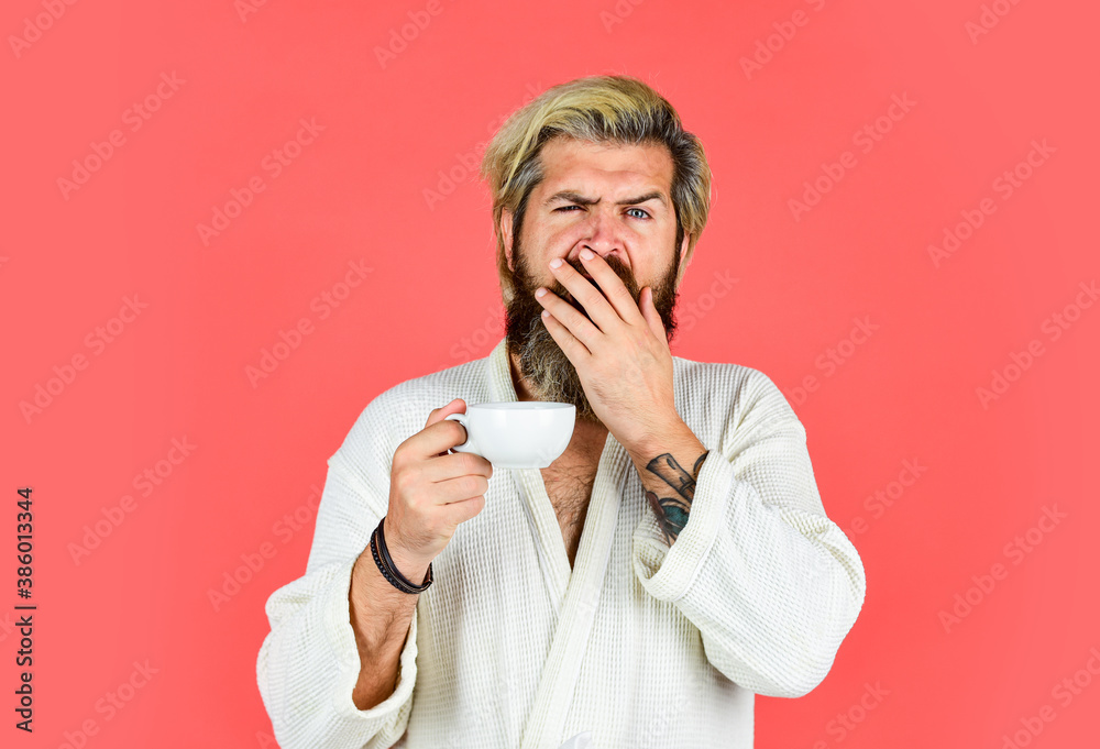 Breakfast concept. Morning begins with coffee. Understanding Your Daily Rhythms. Man with beard in bathrobe enjoy morning coffee. Guy in domestic clothes hold coffee cup. Bearded man with mug Breakfast concept. Morning begins with coffee. Understanding Your Daily Rhythms. Man with beard in bathrobe enjoy morning coffee. Guy in domestic clothes hold coffee cup. Bearded man with mug