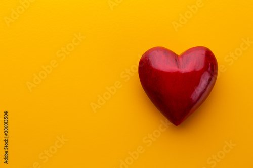 Red heart  valentine day greeting card. Wooden hearts background.